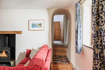 Bedroom 1 is tucked away at the end of this hallway. Please mind the steps.