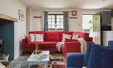 There's plenty of seating for everyone in the cosy living-room. - Thumbnail Image