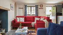 There's plenty of seating for everyone in the cosy living-room.