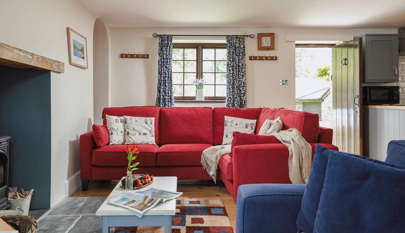 There's plenty of seating for everyone in the cosy living-room.