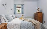 Light and airy, Bedroom 1 is very cute and welcoming. - Thumbnail Image