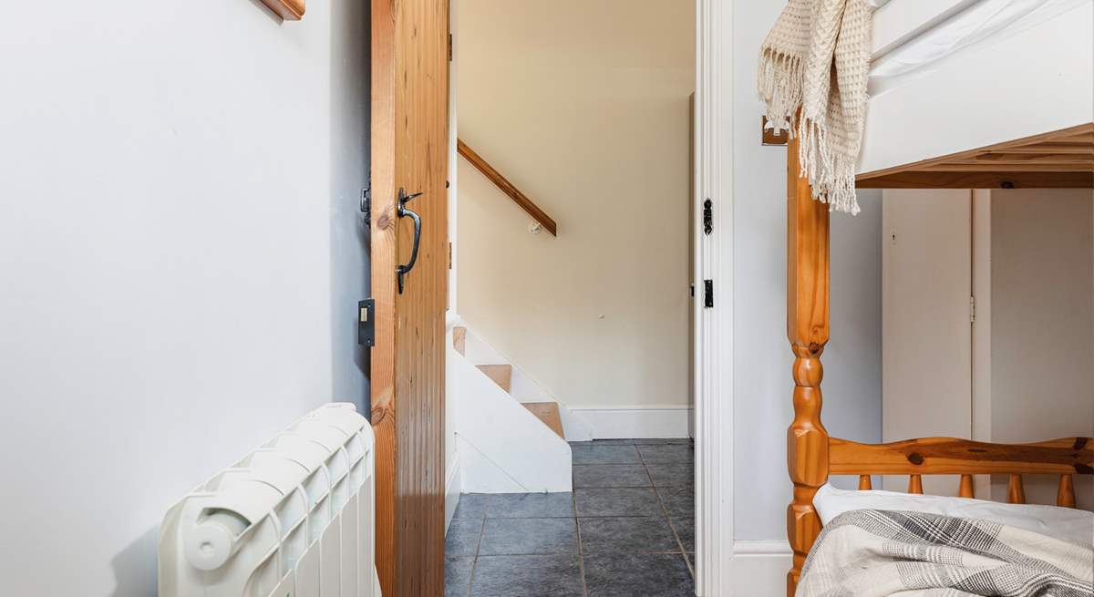 The steps leading down from the living-area into the utility-room which then leads into the bunk room.