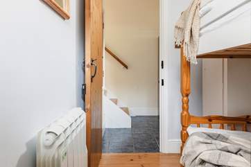 The steps leading down from the living-area into the utility-room which then leads into the bunk room.