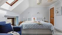 Bedroom 4 is home to this super-king bed. What a fabulous bed to jump into after a long day of entertainment and adventure.