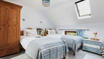 The delightful twin room is a great bedroom for both young and old, especially as it has a spacious en suite with bath and fitted shower.