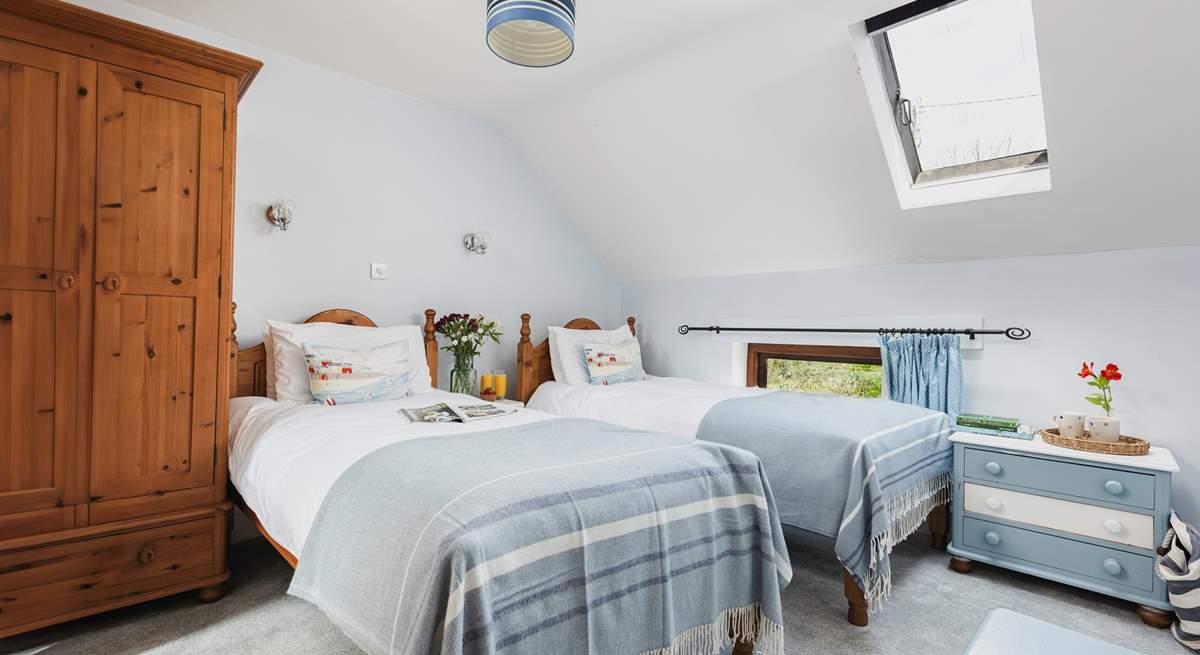 The delightful twin room is a great bedroom for both young and old, especially as it has a spacious en suite with bath and fitted shower.