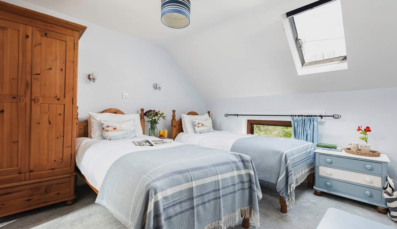 The delightful twin room is a great bedroom for both young and old, especially as it has a spacious en suite with bath and fitted shower.