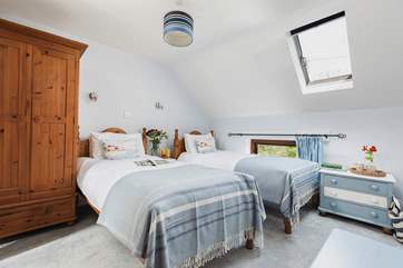 The delightful twin room is a great bedroom for both young and old, especially as it has a spacious en suite with bath and fitted shower.