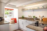 The charming and cute kitchen.