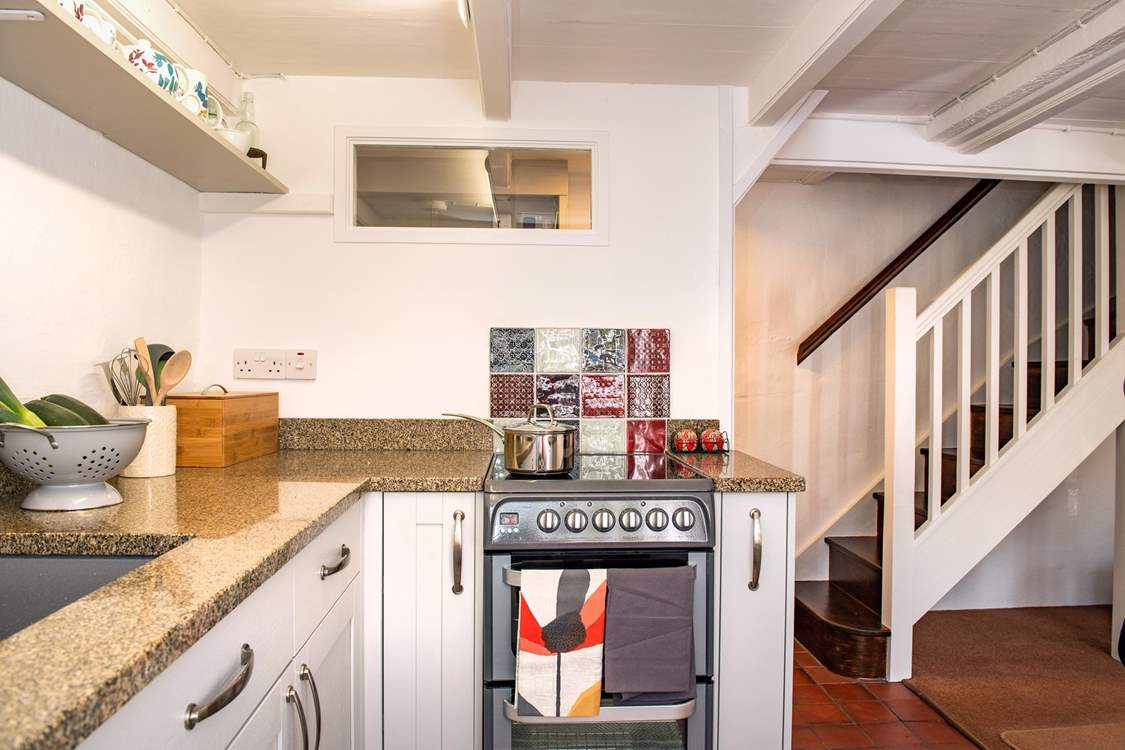 The open plan kitchen/diner leads up to the two bedrooms.