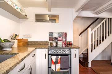 The open plan kitchen/diner leads up to the two bedrooms.