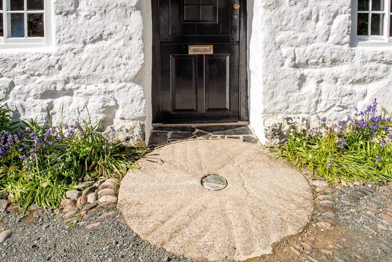 The original millstone makes for a fabulous doorstep.