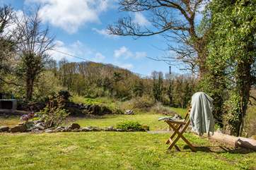 The garden looks over fields and woodland.
