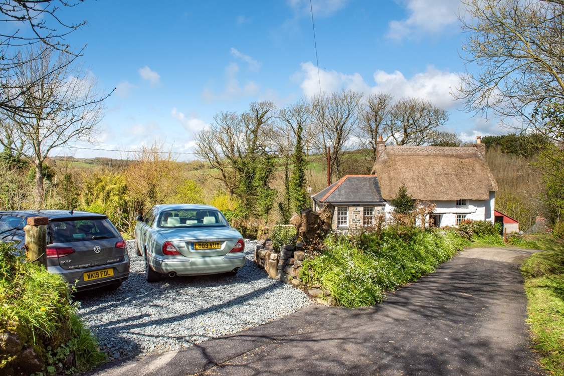 There is parking for two cars to the side of the cottage.