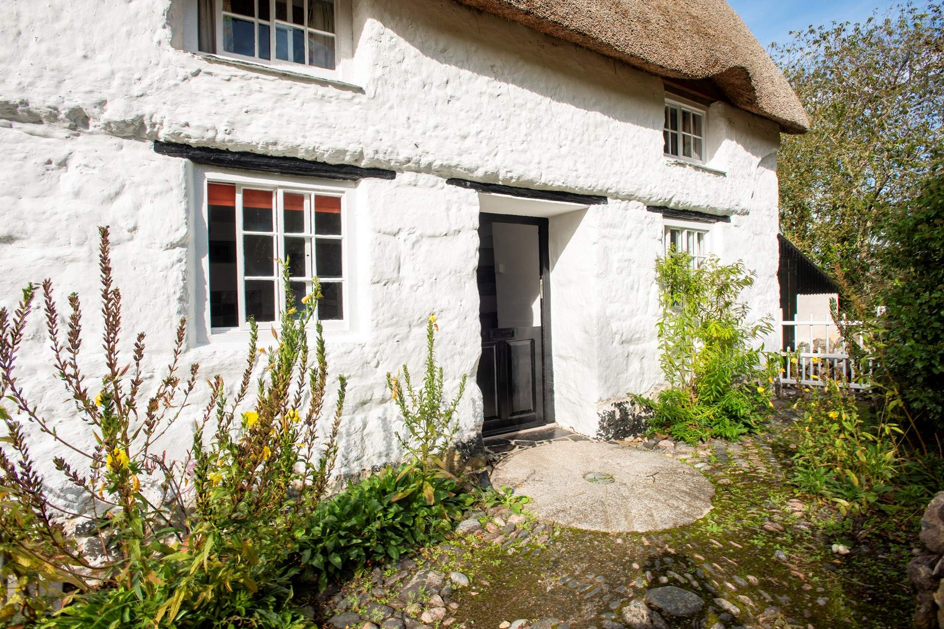 The original millstone makes for a fabulous doorstep.