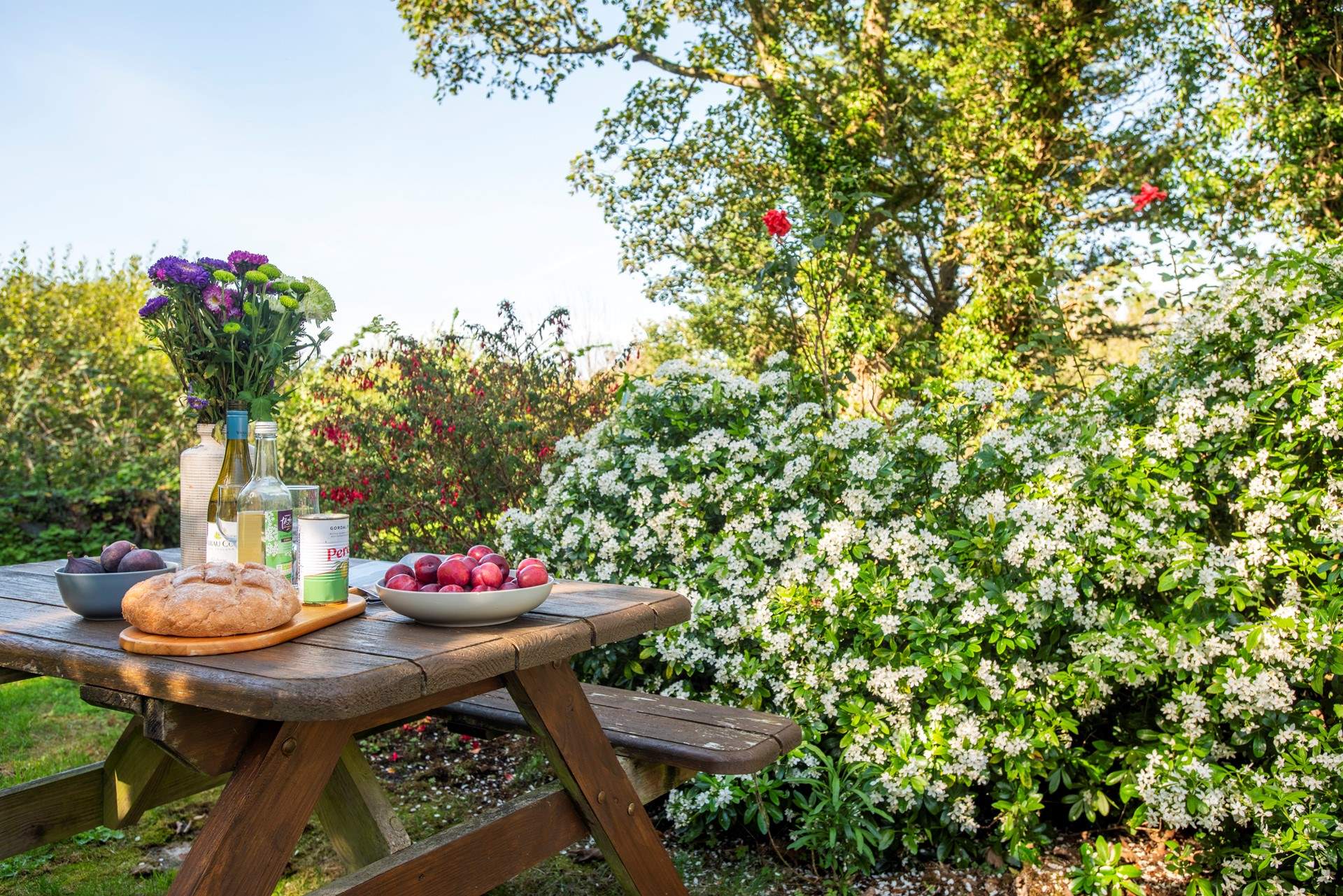 The cottage garden is aromatic and abundant.