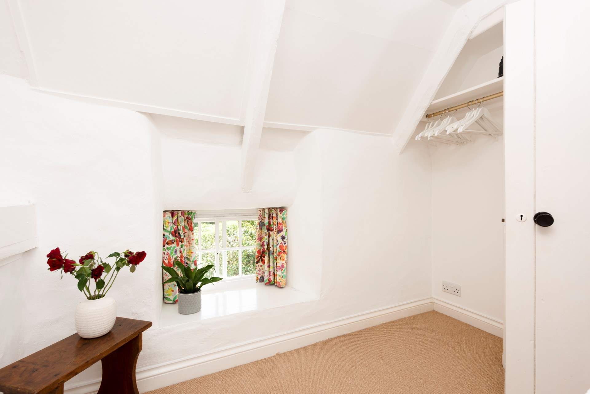 Looking out towards the cottage window in the single room.