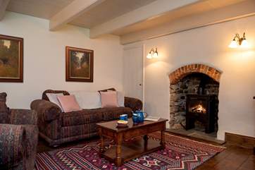 The cosy sitting-room has a warming wood burner (the floorboards are now a light pine and photos to follow).