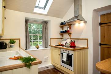 The farmhouse-style kitchen is well-equipped.