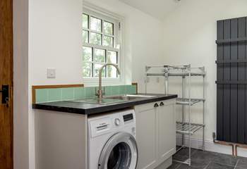 The utility-room is perfect for muddy boots, sandy towels and wet dogs, there is even an electric drying rack!