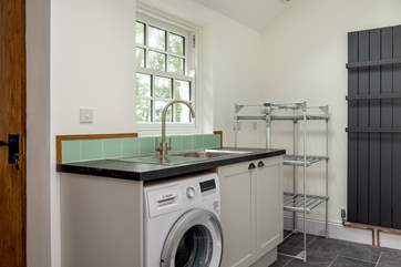 The utility-room is perfect for muddy boots, sandy towels and wet dogs, there is even an electric drying rack!