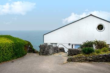 Welcome to The Sea House, the parking space is between the wall and the house.