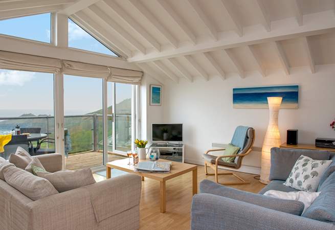 The open plan living space maximises on the view.