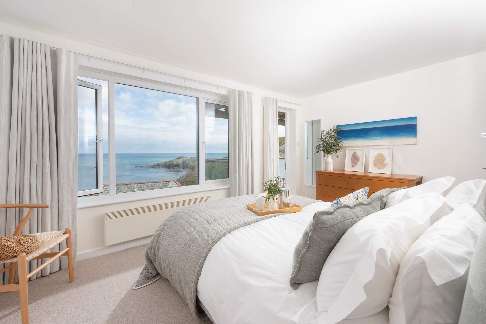 Bedroom 1 has a stunning ocean view and access to the bottom deck.