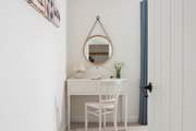 Get ready for dinner at the dressing table in bedroom 2.