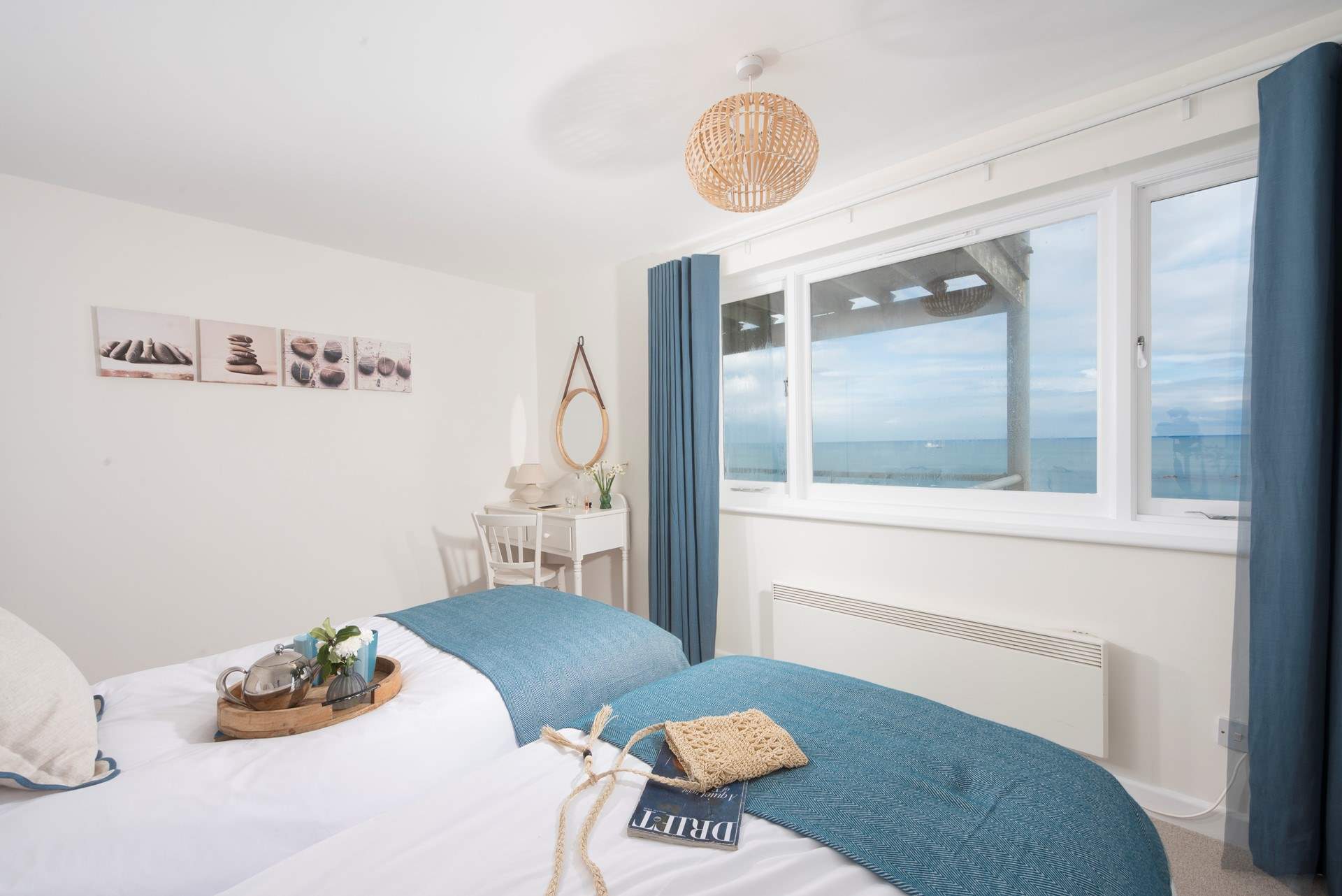 Bedroom 2 styled with delicate coastal hues that co-ordinate with the fabulous view.