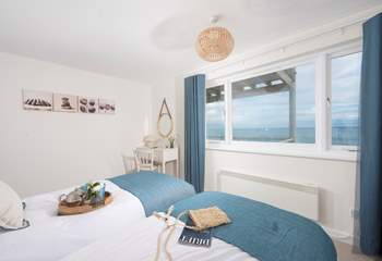 Bedroom 2 styled with delicate coastal hues that co-ordinate with the fabulous view.