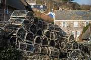 Lobster pots line the wall in Cadgwith.