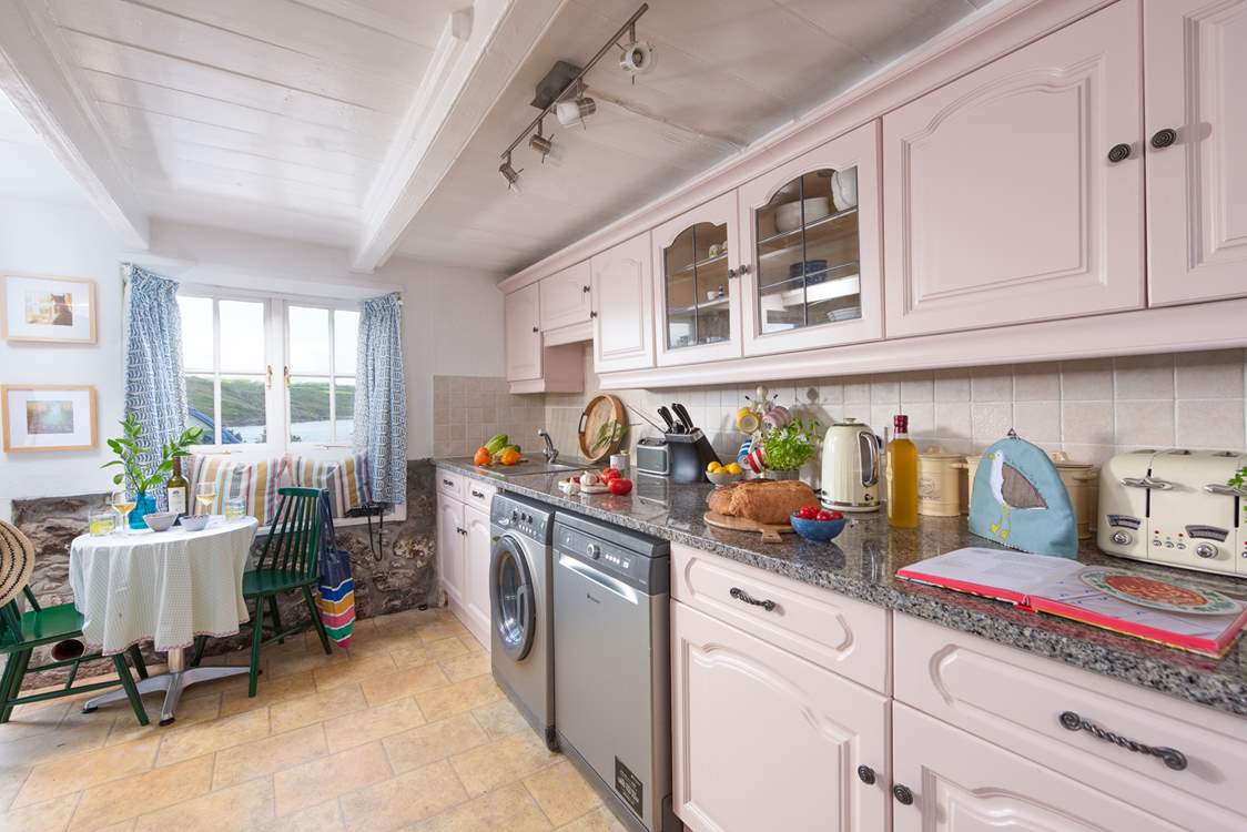 There is a small table in the kitchen, the perfect place to chat with the chef.