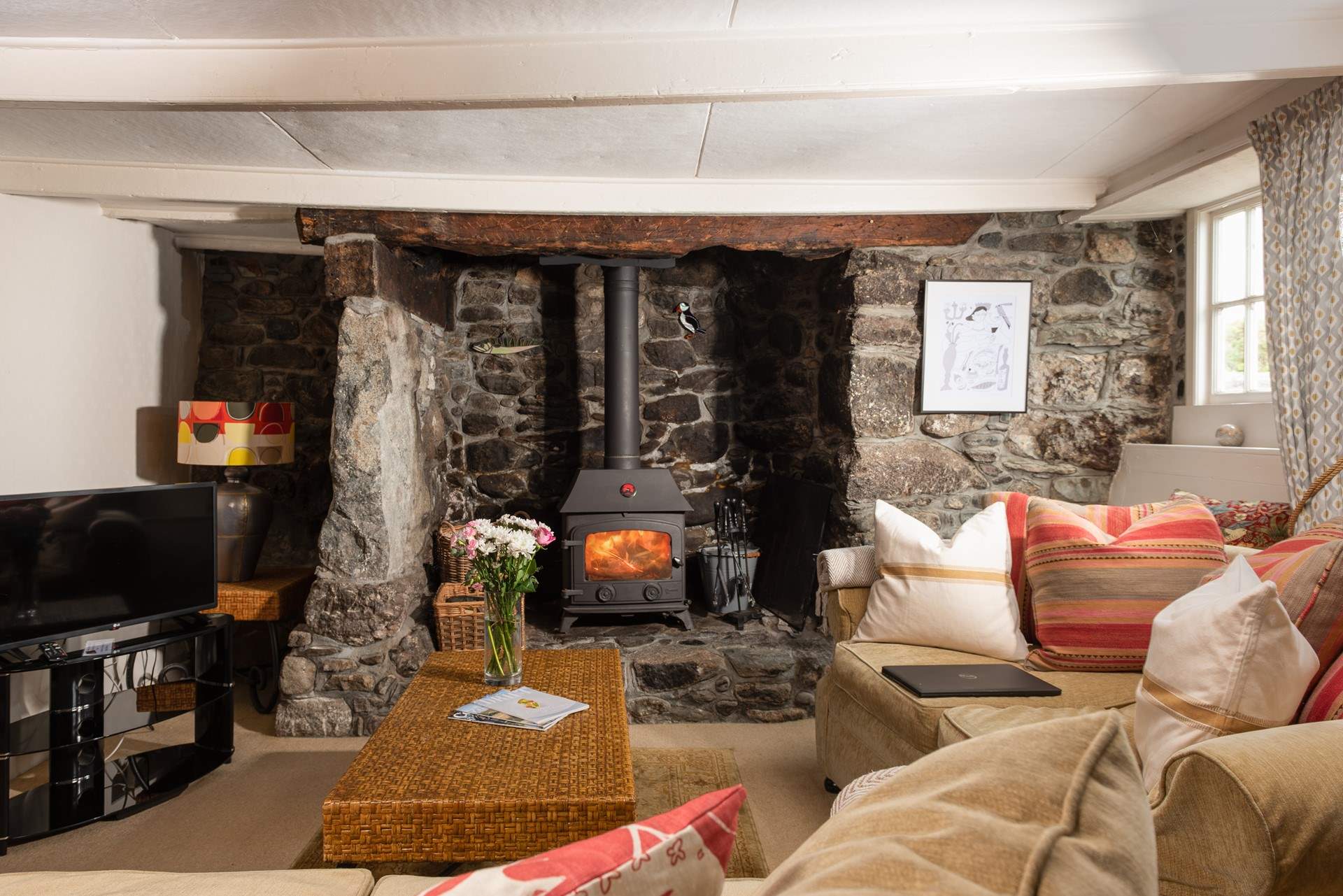 There is a stunning inglenook fireplace with wood-burner to keep you toasty.