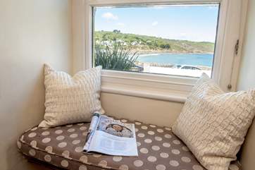 The sitting-room has a cute window seat, settle down with a good book.