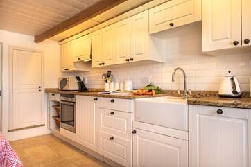 The kitchen is very charming.