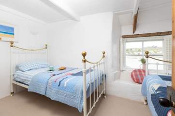 The twin bedroom has lovely sea views.