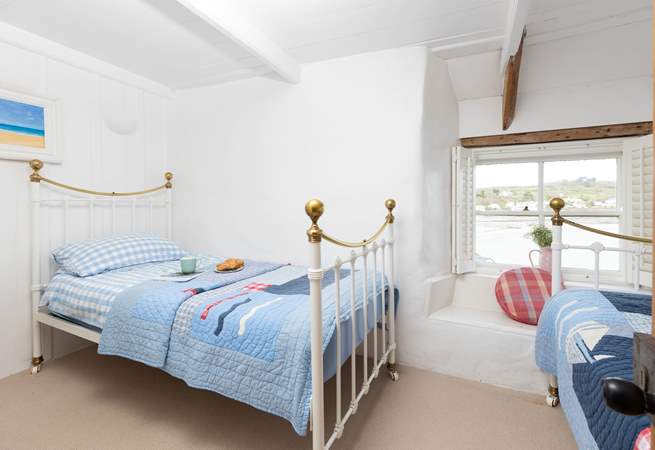 The twin bedroom has lovely sea views.