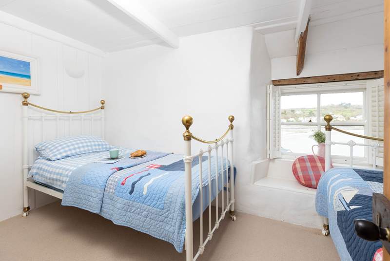 The twin bedroom has lovely sea views.