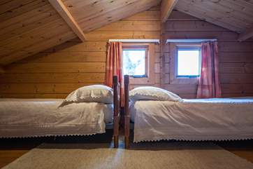 Sneak up the ladder and you will find this charming children's twin bedroom (Bedroom 3). Please be very careful when negotiating the ladder.