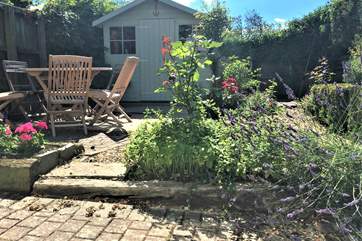 This pretty enclosed patio is a lovely spot to relax in the Island sunshine