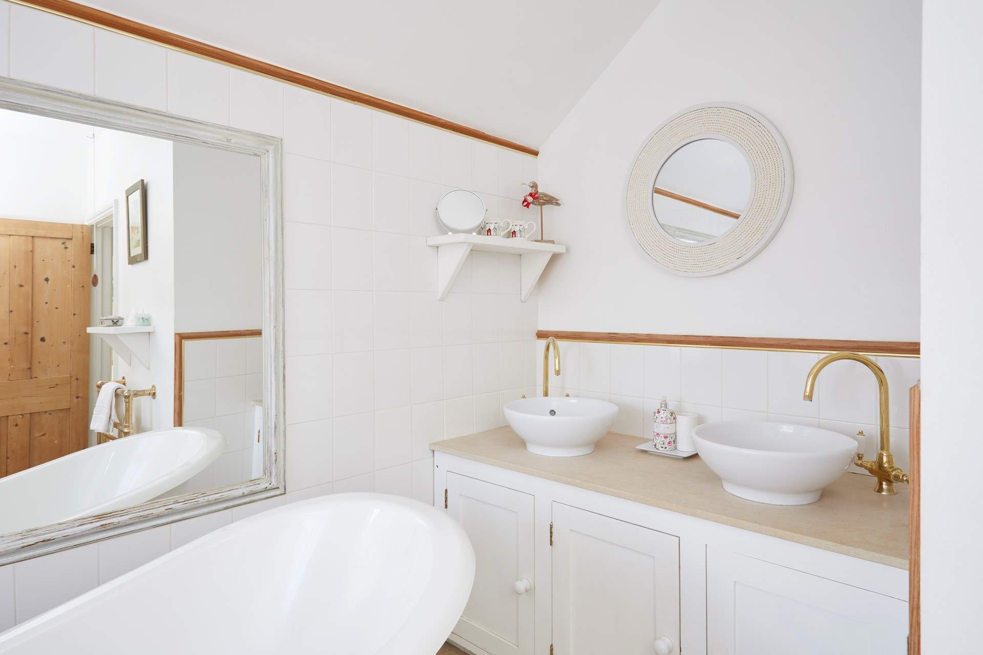 The family bathroom is bright and airy.