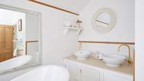 The family bathroom is bright and airy.