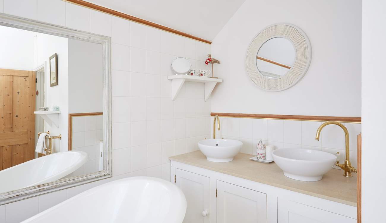 The family bathroom is bright and airy.