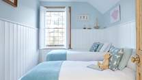 Bedroom 2 with twin beds has been beautifully decorated with guests' comfort in mind.