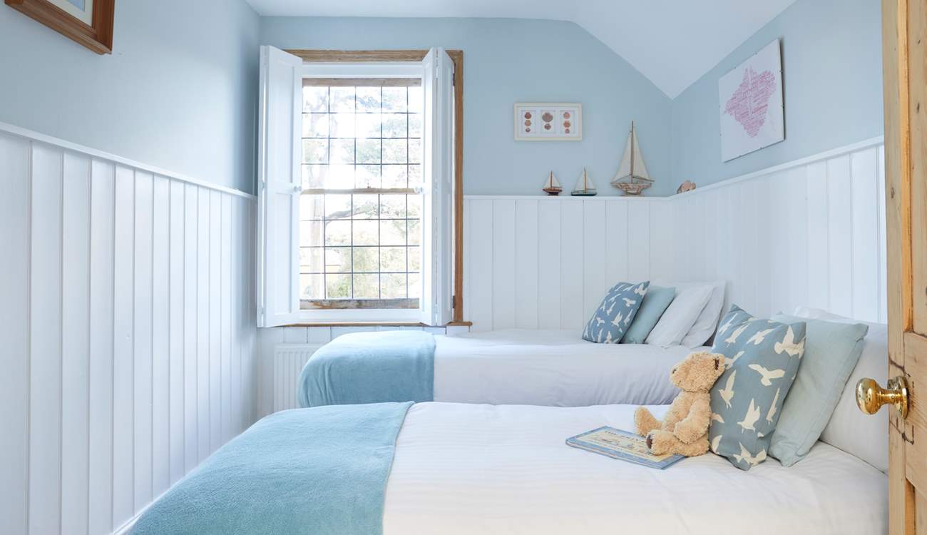 Bedroom 2 with twin beds has been beautifully decorated with guests' comfort in mind.