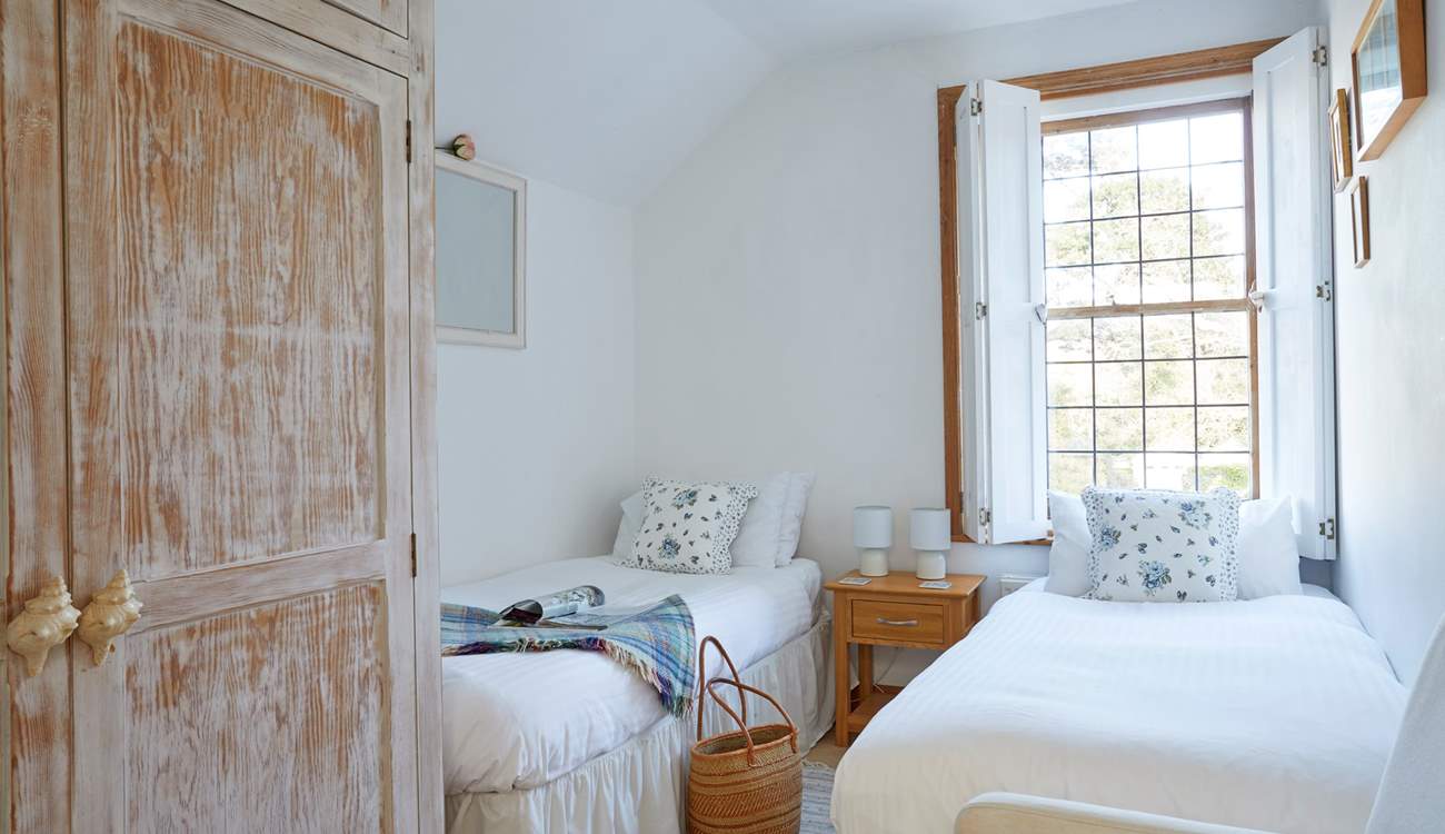 Bedroom 3 is another pretty twin bedroom with Classic Cottage charm. 