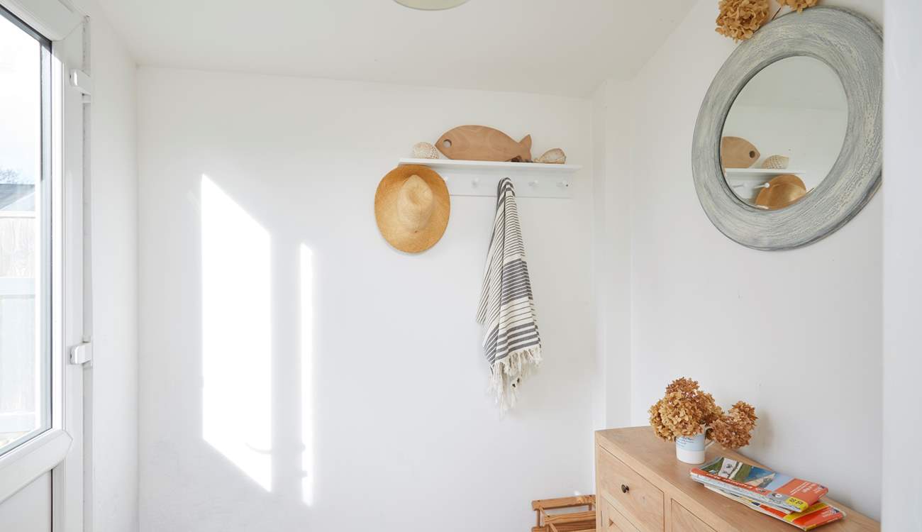 The porch entrance to the kitchen is ideal for storing your holiday essentials.