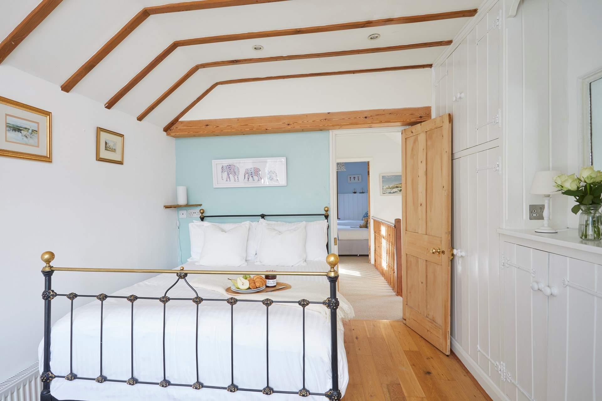 Bedroom 1 with double bed and en suite shower-room overlooks the pretty patio area.