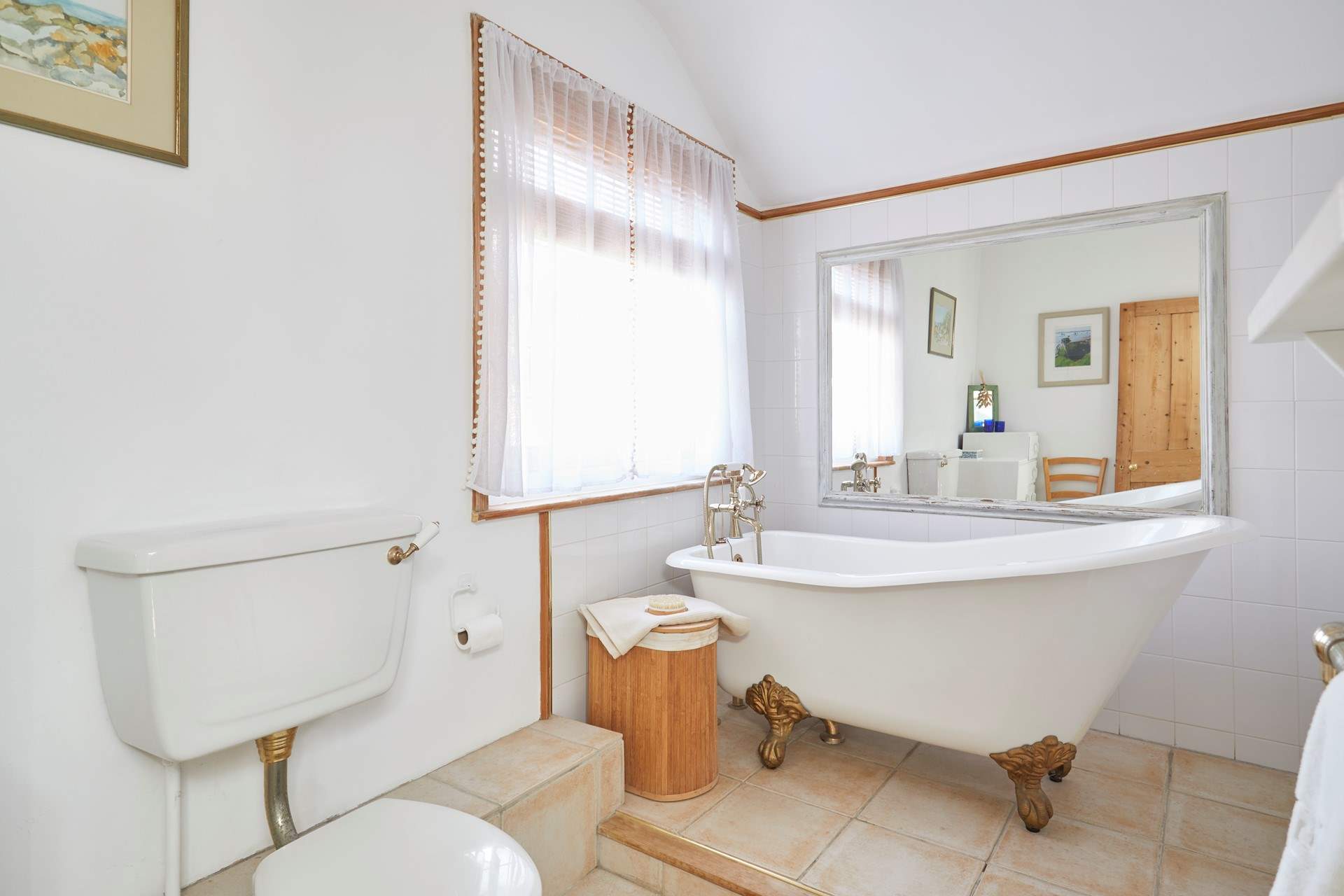Take a long soak after a busy day in the stunning roll-top bath - please note there is a step up to the bath.